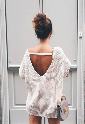 white, chunky, oversized sweater with open back and mini shorts