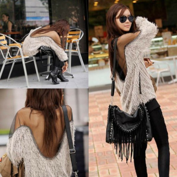 Fuzzy two-tone sweater with an open back and black skinny jeans