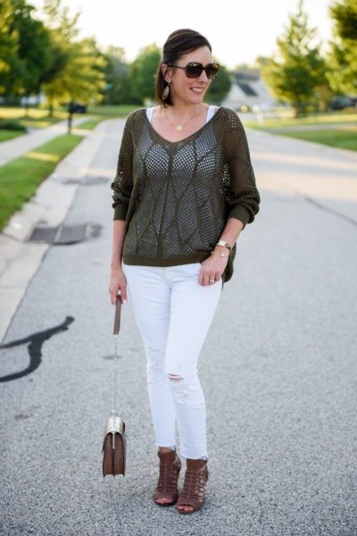 gray, semi-transparent sweater with white, slim-cut ankle jeans