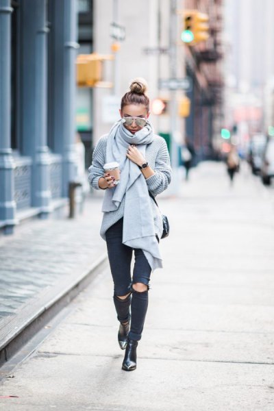 gray knitted scarf with torn black skinny jeans