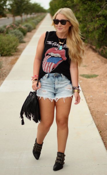 black graphic sleeveless top with light blue high waisted denim shorts