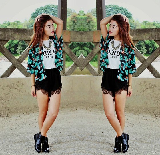 black and white cardigan with tribal print and high-cut shorts with scalloped hem