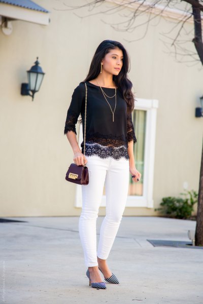 black lace top with scalloped hem and white skinny jeans