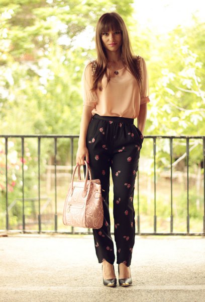 Light yellow chiffon tank top with black trousers with a floral pattern