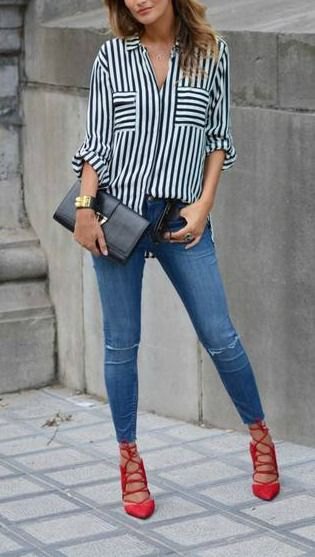 black and white striped shirt with buttons, blue jeans and red lace-up shoes