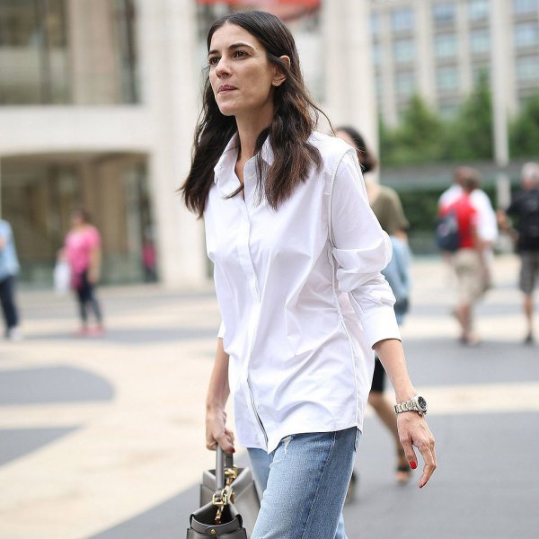 white oversized formal shirt with buttons and blue straight-leg jeans