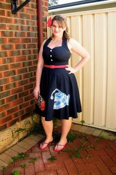 black belted midi dress and flared midi dress with gray flip-flops