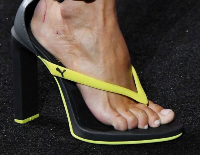 High heels flip flops with yellow and black sports brands and jogging pants