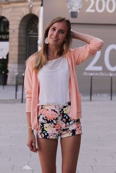 blush pink cardigan with white t-shirt and black floral cotton shorts