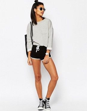 gray sweater with black mini waist shorts