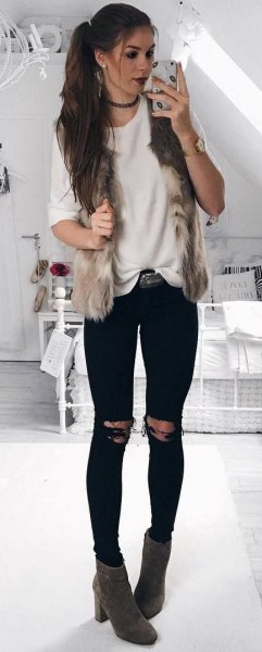 white comfortable sweater with black jeans and gray boots
