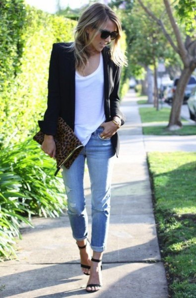 black blazer with white tank top and light blue jeans with cuff