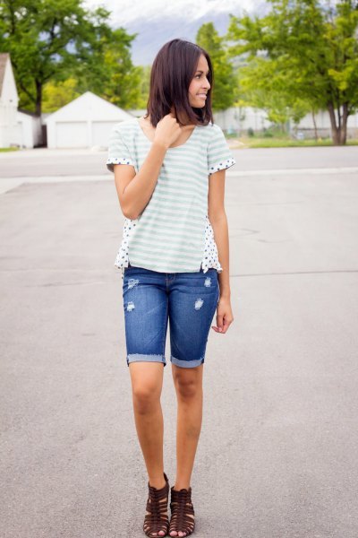 white and light gray striped t-shirt with blue denim shorts with long cuffs
