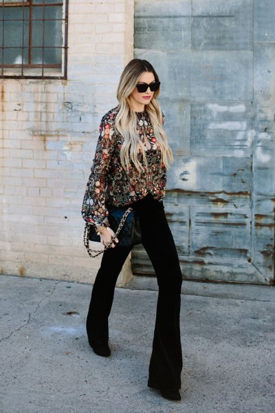 silver sequin sweater with black flared jeans