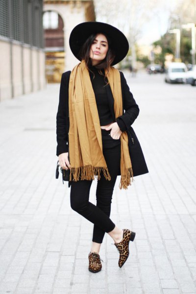 black longline blazer with orange fringed scarf and loafers with leopard print