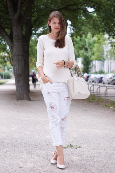white sweater with scoop neck and matching boyfriend jeans with ripped