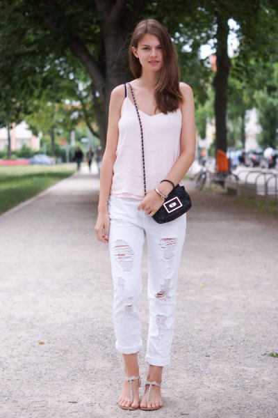 white v-neck tank with ripped boyfriend jeans and flat sandals