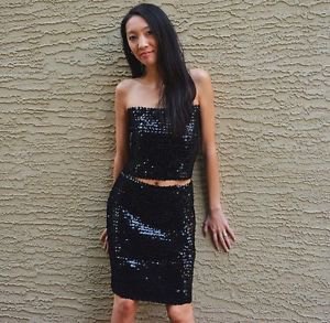 black tube top with sequins and matching knee-length skirt