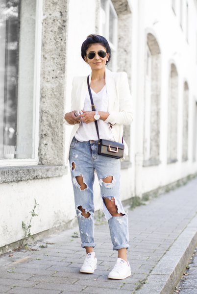 white blazer with V-neck t-shirt and heavily torn jeans