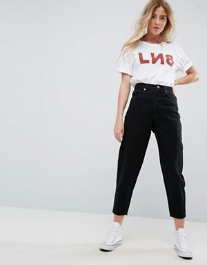 white graphic t-shirt with cropped jeans and high canvas sneakers