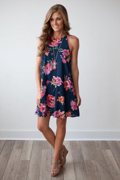 Navy swing mini swing dress with floral pattern and nude sandals