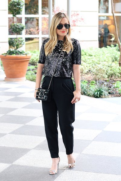 black sequin top with loosely cut dress pants