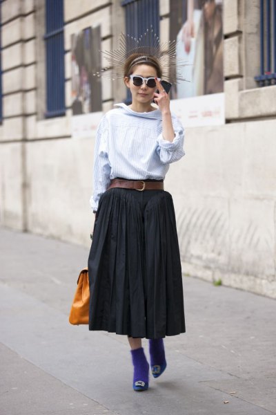 light blue blouse with black midi pleated skirt with belt