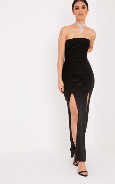 black strapless maxi dress with double slit and open toe heels with ankle straps