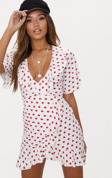 white and red heart patterned mini ruffle wrap dress with V-neck