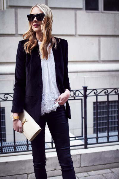 black oversized velvet jacket with white tunic top made of lace and slim jeans