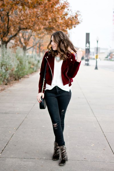 black short jacket with white chiffon blouse and torn jeans