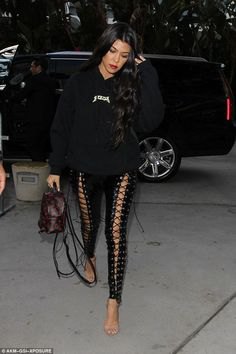 black hoodie with laced leather leggings and bare heels