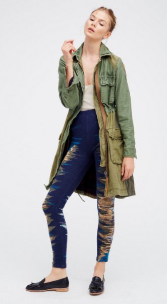 gray longline military jacket with dark blue leggings and loafers