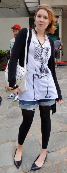graphic t-shirt with white tunic, denim shorts and black footless tights