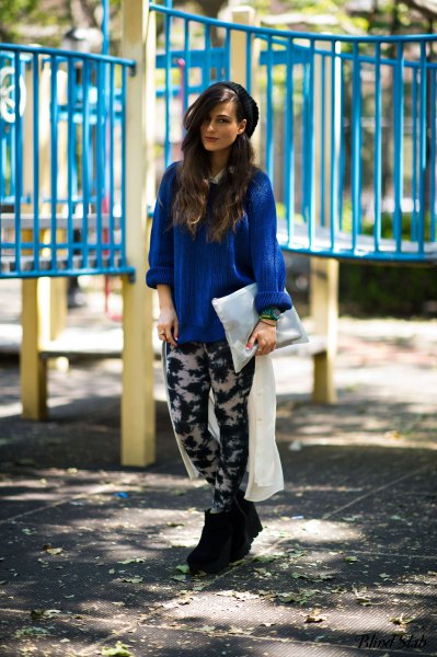 royal blue blouse with a relaxed fit and black and white leggings