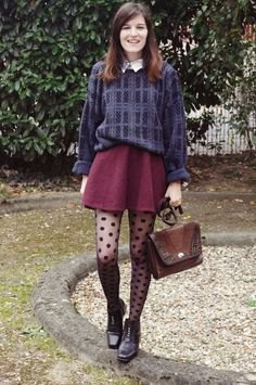 gray and dark blue sweater with brown shorts and polka dot tights