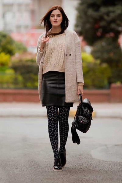 light gray longline cashmere cardigan with black leather mini skirt