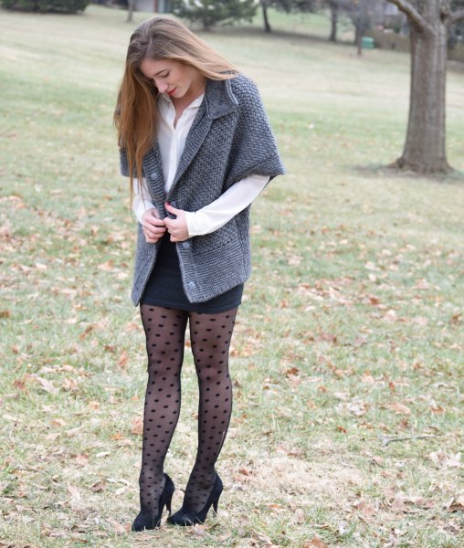 gray cardigan with half sleeves, black, form-fitting mini skirt and dotted tights
