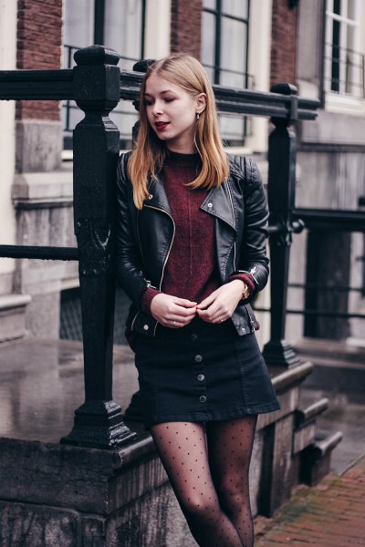 black leather biker jacket with mini skirt and dotted tights