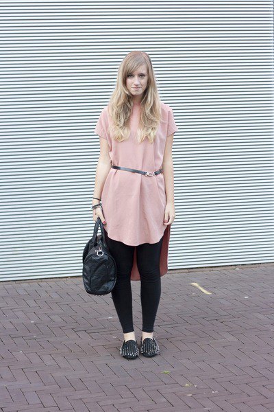 Light pink tunic top with belt, black leggings and spiked loafers
