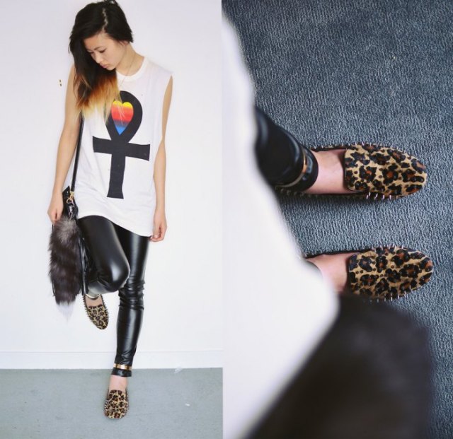 white sleeveless graphic t-shirt with black leather leggings and loafers with leopard print