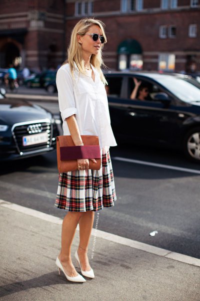 white blouse with button closure and checkered skirt with a relaxed fit