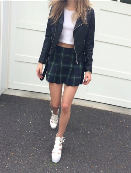 black leather jacket with white t-shirt and mini skirt