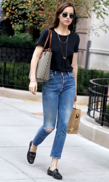 black T-shirt with blue, slim fit ankle jeans and loafers