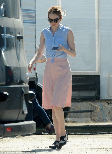 sky blue knotted sleeveless shirt with knee-length chiffon skirt in pink and loafers