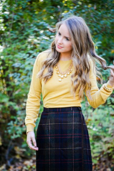 Lemon yellow sweater with a dark wool midi skirt