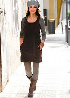 black cord mini dress with gray leggings and knee-high leather boots