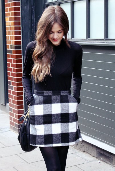 figure-hugging sweater with black and white checkered wool mini skirt