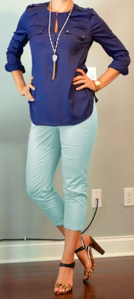 Dark blue long sleeve keyhole blouse with white, cropped pants