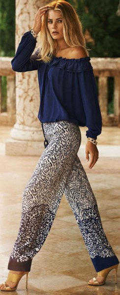 off-the-shoulder dark blue blouse with printed pants with a relaxed fit